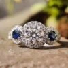 2.13 TCW Round Cut With Blue Sapphire Three Stones Engagement Ring