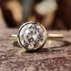 8.00 MM Round Colorless Moissanite Bezel Set Solitaire Wedding Ring