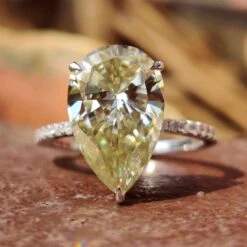 Unique 5.16 TCW Pear Cut Hidden Halo Pave Set Moissanite Engagement Ring