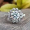 Round Brilliant Cut Moissanite Diamond Cathedral Halo Engagement Ring